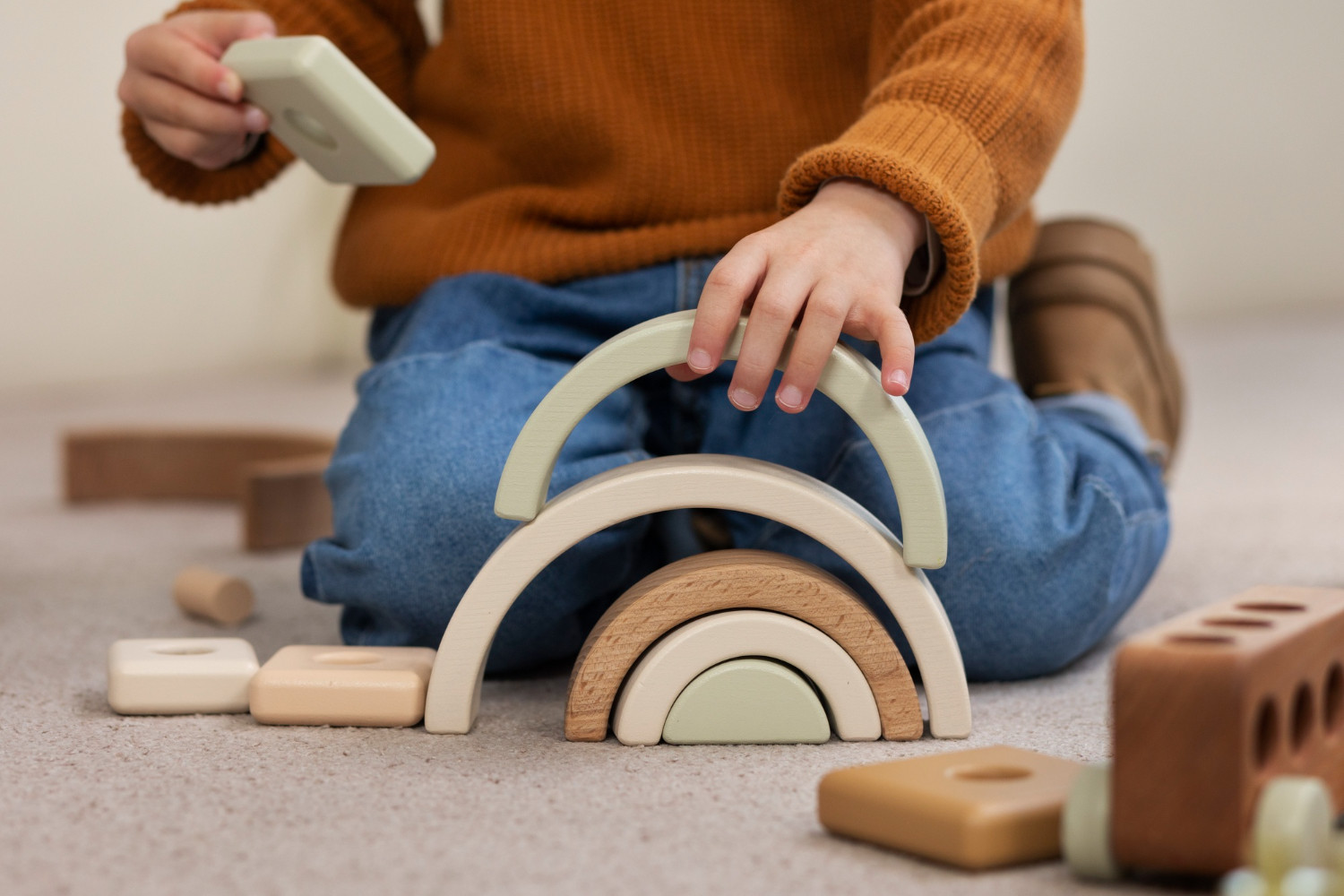 front-view-boy-playing-with-eco-toys-indoors